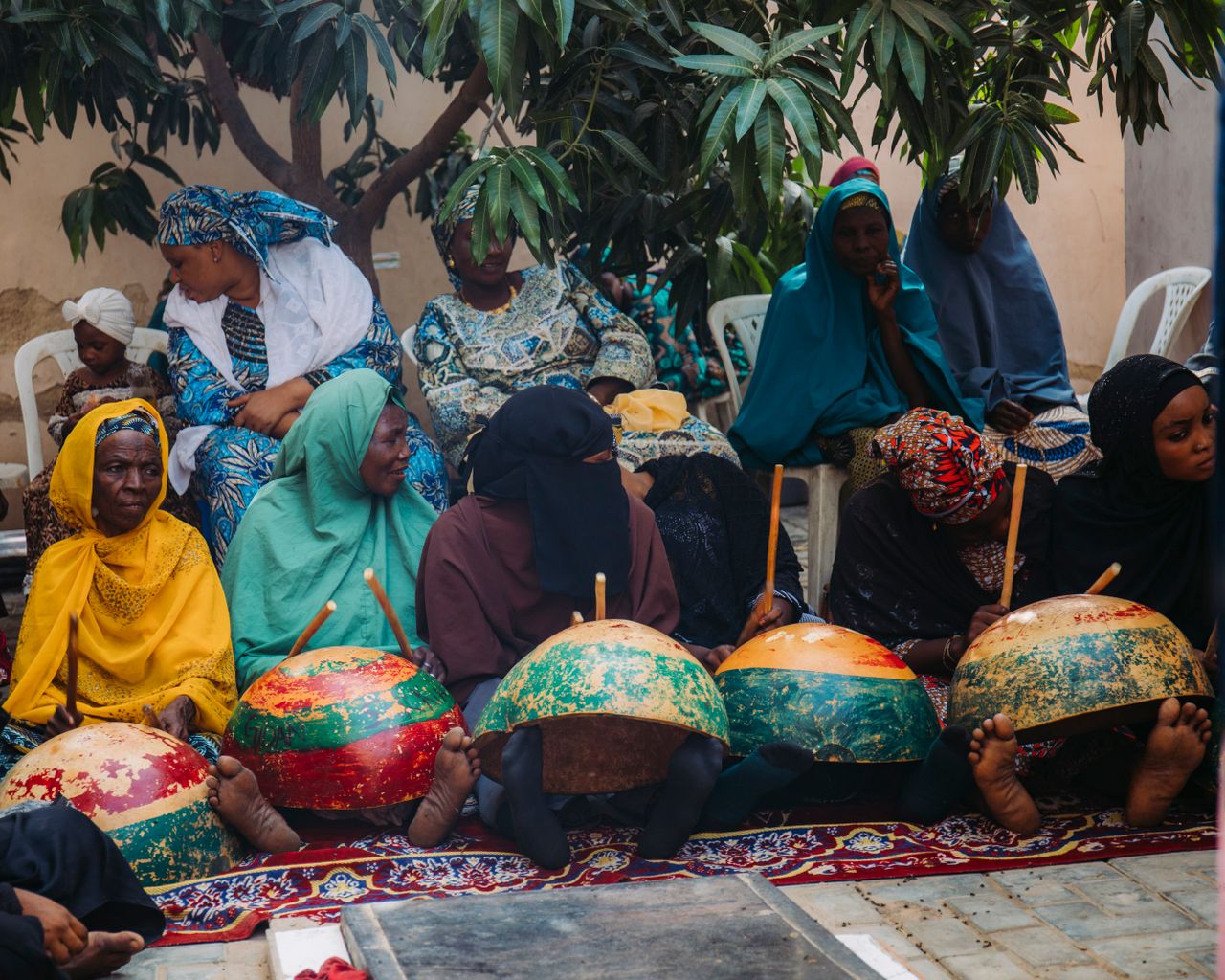KICE Mobilises 200 Volunteers for Tana Delta Mangrove Restoration Women in traditional attire gather for a cultural event in Kano, Nigeria, showcasing community traditions.